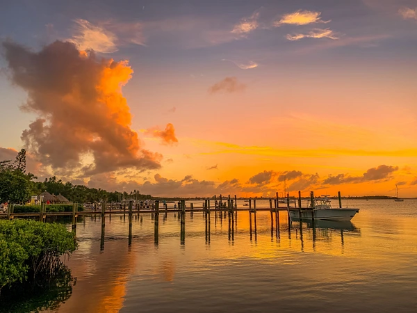 Stunning sunset over Key Largo with colorful sky and calm waters.
