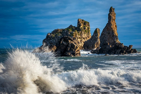 Scenic view of Pedrero in Pendueles, Spain, featuring rocky coastline and vibrant ocean waters.