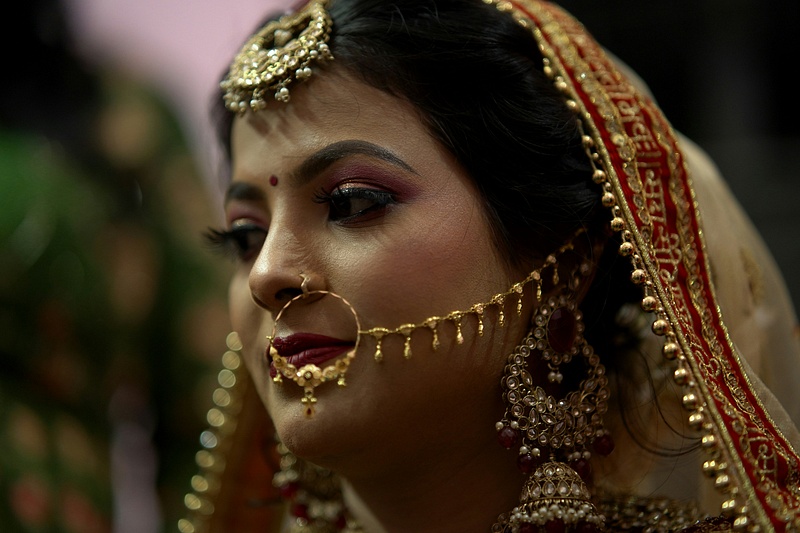 Bridal Profile with Gold Nath and Crimson Veil