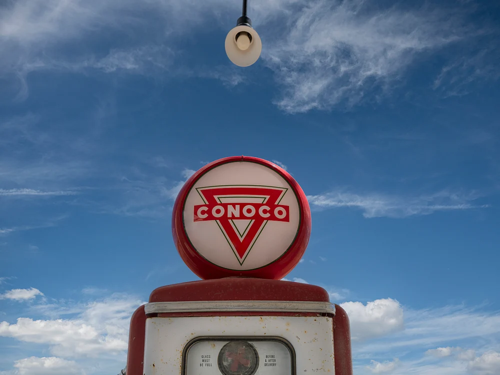 Vintage Conoco Gas Pump Against Clear Blue Sky