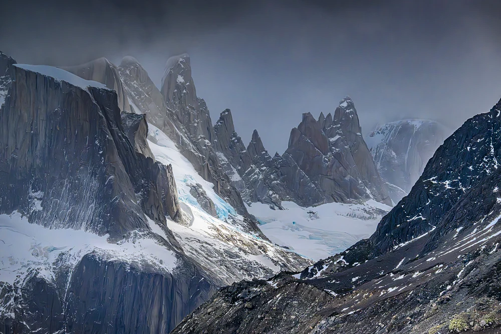 Dramatic Peaks of Patagonia Under Cloudy Skies