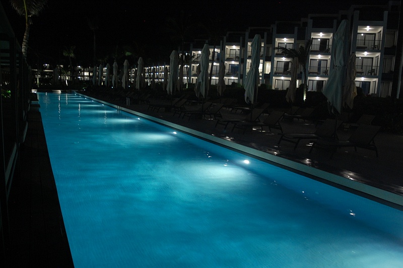 Excellence Club pool illuminated at night