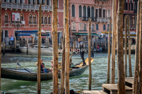 Gondola-between-mooring-poles-Venice-Italy - Photographs of Venice, Italy..
